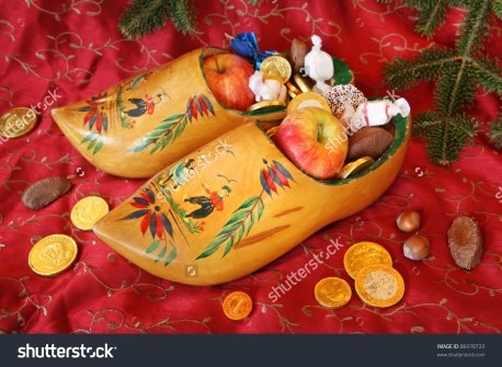 stock-photo-vintage-wooden-shoes-filled-with-treats-for-st-nicholas-day-86978723